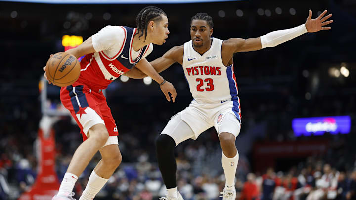 Nov 17, 2024; Washington, District of Columbia, USA; Washington Wizards forward Kyshawn George (18) dribbles the ball as Detroit Pistons guard Jaden Ivey (23) defends: Geoff Burke-Imagn Images