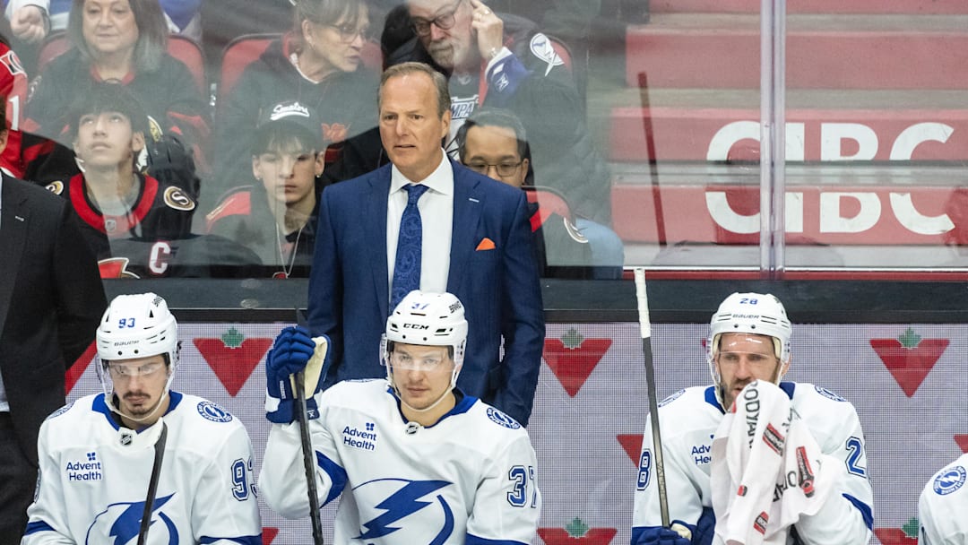 Apr 3, 2025; Ottawa, Ontario, CAN; Tampa Bay Lightning Head coach Jon Cooper follows the action in the third period against the  Ottawa Senators at the Canadian Tire Centre. Mandatory Credit: Marc DesRosiers-Imagn Images