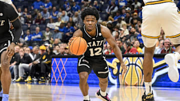 Mar 13, 2025; Nashville, TN, USA;  Mississippi State Bulldogs guard Josh Hubbard (12) dribbles the ball against the Missouri Tigers during the second half at Bridgestone Arena. Mandatory Credit: Steve Roberts-Imagn Images