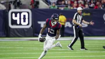 Jan 13, 2024; Houston, Texas, USA; Houston Texans wide receiver Nico Collins (12) runs with the ball during the second quarter in a 2024 AFC wild card game at NRG Stadium. Mandatory Credit: Thomas Shea-USA TODAY Sports