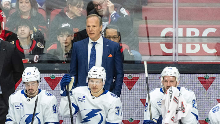 Apr 3, 2025; Ottawa, Ontario, CAN; Tampa Bay Lightning Head coach Jon Cooper follows the action in the third period against the  Ottawa Senators at the Canadian Tire Centre. Mandatory Credit: Marc DesRosiers-Imagn Images
