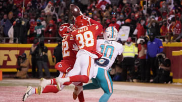 Jan 13, 2024; Kansas City, Missouri, USA; Kansas City Chiefs cornerback L'Jarius Sneed (38) and cornerback Trent McDuffie (22) break up a pass intended for Miami Dolphins wide receiver Tyreek Hill (10) during the second half of the 2024 AFC wild card game at GEHA Field at Arrowhead Stadium. Mandatory Credit: Denny Medley-USA TODAY Sports