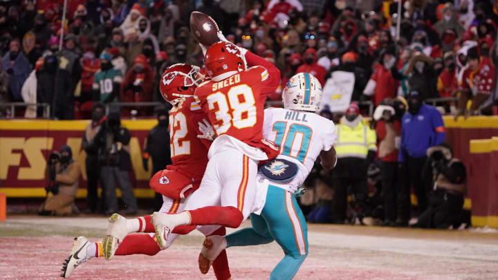 Jan 13, 2024; Kansas City, Missouri, USA; Kansas City Chiefs cornerback L'Jarius Sneed (38) and cornerback Trent McDuffie (22) break up a pass intended for Miami Dolphins wide receiver Tyreek Hill (10) during the second half of the 2024 AFC wild card game at GEHA Field at Arrowhead Stadium. Mandatory Credit: Denny Medley-USA TODAY Sports