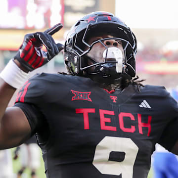 Texas Tech Red Raiders wide receiver Johncarlos Miller (9) reacts after scoring against the Kansas Jayhawks in the first half at Jones AT&T Stadium.