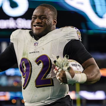 Dec 17, 2023; Jacksonville, Florida, USA;  Baltimore Ravens defensive tackle Justin Madubuike (92) celebrates after beating the Jacksonville Jaguars at EverBank Stadium. Mandatory Credit: Nathan Ray Seebeck-Imagn Images