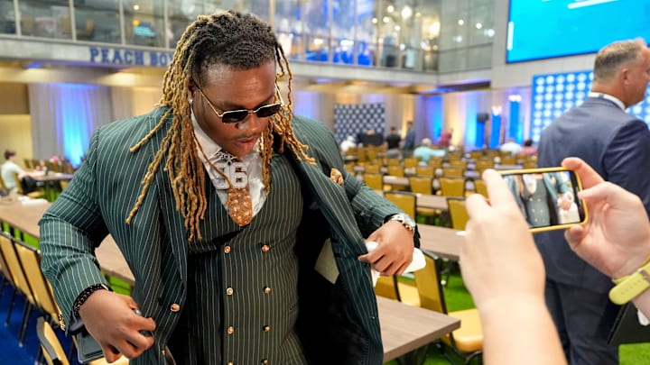 July 16, 2025; Atlanta, GA, USA; Alabama defensive lineman Tim Keenan III does an interview about his clothing during SEC Media Days at the College Football Hall of Fame in Atlanta. July 16, 2025; Atlanta, GA, USA; Alabama defensive lineman Tim Keenan III does an interview about his clothing during SEC Media Days at the College Football Hall of Fame in Atlanta.