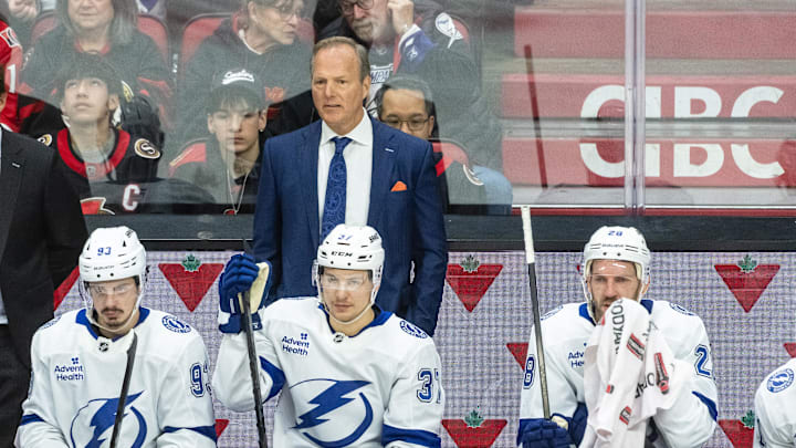 Apr 3, 2025; Ottawa, Ontario, CAN; Tampa Bay Lightning Head coach Jon Cooper follows the action in the third period against the  Ottawa Senators at the Canadian Tire Centre. Mandatory Credit: Marc DesRosiers-Imagn Images