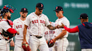 Sep 3, 2025; Boston, Massachusetts, USA; Boston Red Sox pitcher Brennan Bernardino (83) is relieved by manager Alex Cora (13) against the Cleveland Guardians in the first inning at Fenway Park. Mandatory Credit: David Butler II-Imagn Images