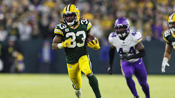 Jan 1, 2023; Green Bay, Wisconsin, USA;  Green Bay Packers running back Aaron Jones (33) rushes with