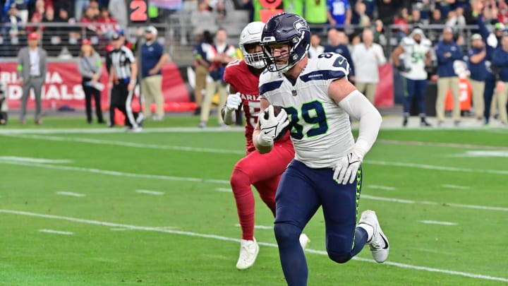 Jan 7, 2024; Glendale, Arizona, USA; Seattle Seahawks tight end Will Dissly (89) scores a touchdown in the first half against the Arizona Cardinals at State Farm Stadium. Mandatory Credit: Matt Kartozian-USA TODAY Sports