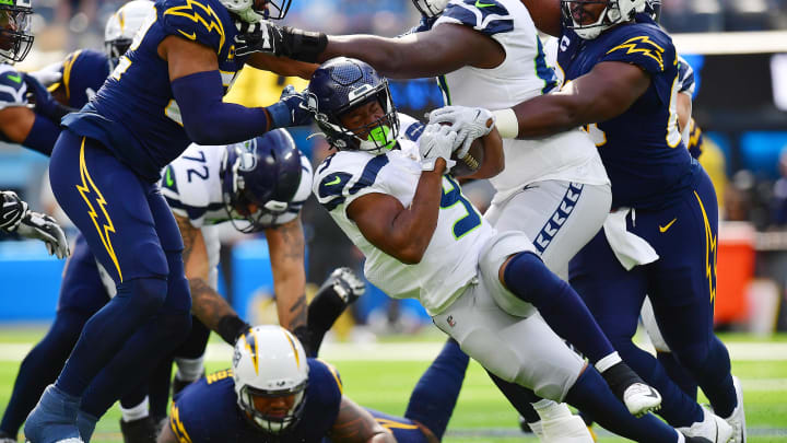 Oct 23, 2022; Inglewood, California, USA; Seattle Seahawks running back Kenneth Walker III (9) runs the ball against the Los Angeles Chargers during the first half at SoFi Stadium. Mandatory Credit: Gary A. Vasquez-USA TODAY Sports