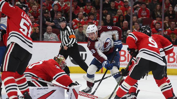 Apr 2, 2025; Chicago, Illinois, USA; Colorado Avalanche center Martin Necas (88) takes a shot on goal past Chicago Blackhawks goaltender Spencer Knight (30) during the second period at United Center. Mandatory Credit: Talia Sprague-Imagn Images