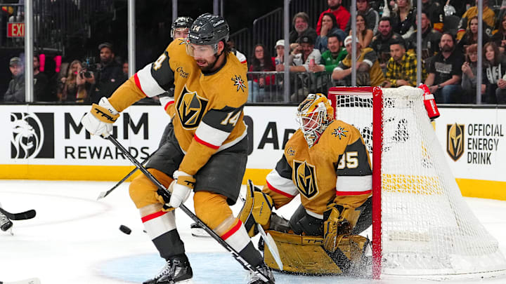 Feb 27, 2025; Las Vegas, Nevada, USA; Vegas Golden Knights defenseman Nicolas Hague (14) looks to block a scoring attempt by the Chicago Blackhawks during the first period at T-Mobile Arena.