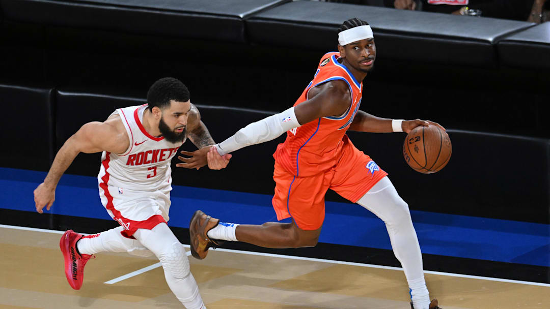 Dec 14, 2024; Las Vegas, Nevada, USA; Oklahoma City Thunder guard Shai Gilgeous-Alexander (2) controls the ball against Houston Rockets guard Fred VanVleet (5) during the fourth quarter in a semifinal of the 2024 Emirates NBA Cup at T-Mobile Arena. Mandatory Credit: Candice Ward-Imagn Images