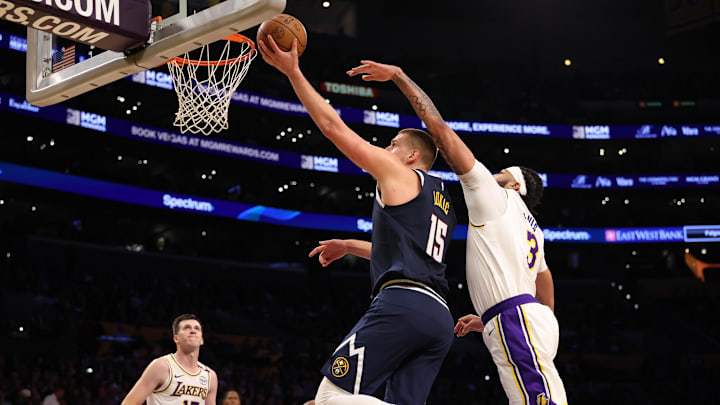 Nikola Jokic scores against the Los Angeles Lakers.