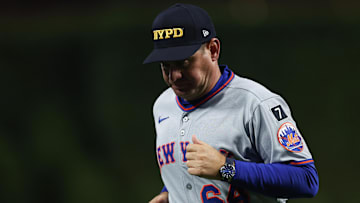 Sep 11, 2025; Philadelphia, Pennsylvania, USA; New York Mets manager Carlos Mendoza (64) jogs back to the dugout after a pitching change during the sixth inning against the Philadelphia Phillies at Citizens Bank Park. Mandatory Credit: Bill Streicher-Imagn Images