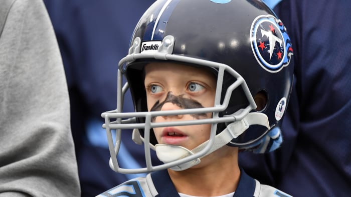 Nov 26, 2023; Nashville, Tennessee, USA; A young Tennessee Titans fan watches warmups before the
