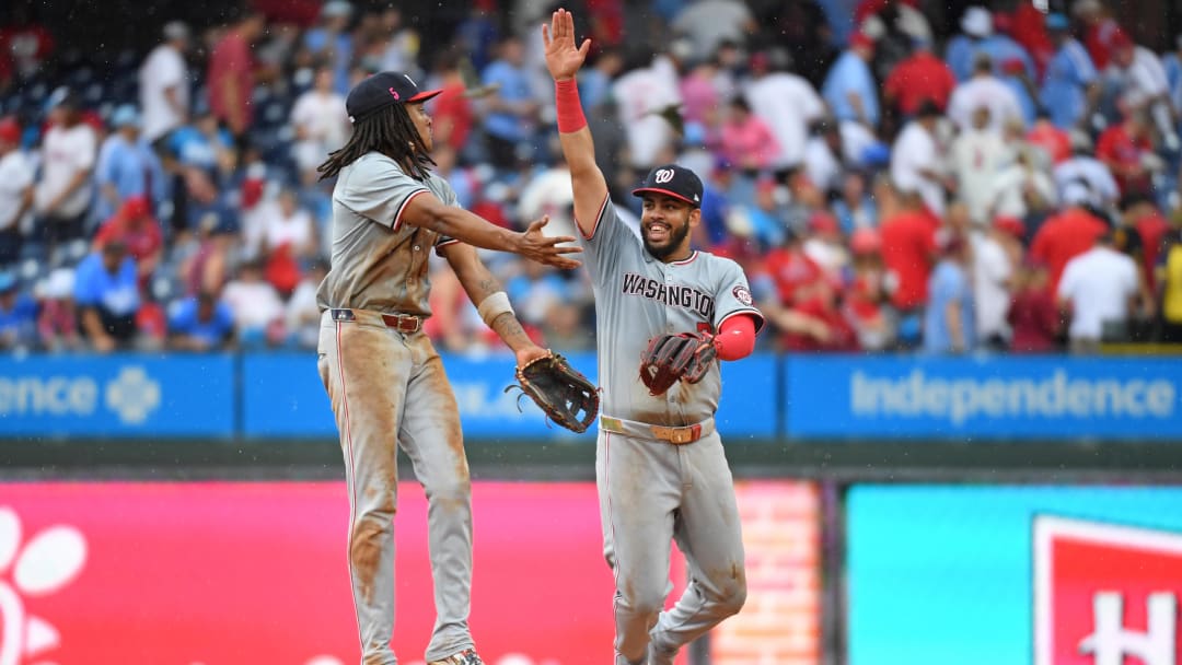 Aug 18, 2024; Philadelphia, Pennsylvania, USA; Washington Nationals shortstop CJ Abrams (5) and second base Luis García Jr. (2) celebrate win against the Philadelphia Phillies at Citizens Bank Park.