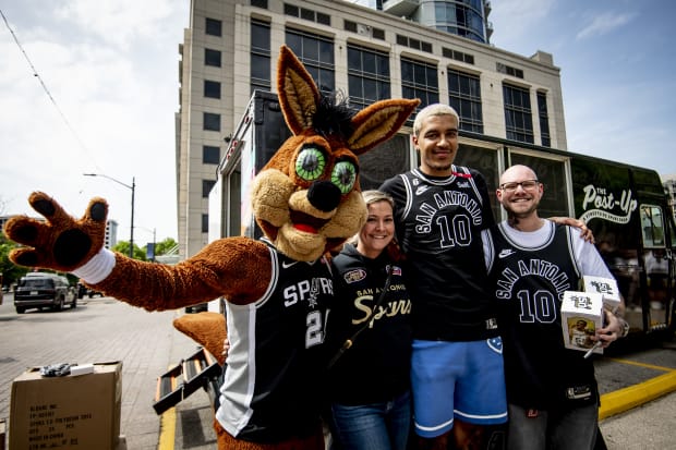 The San Antonio Spurs' Coyote poses with fans at a meet-and-greet event held in Austin during "Spurs Week."