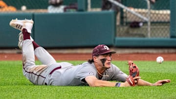Jun 24, 2024; Omaha, NE, USA; Texas A&M Aggies right fielder Jace Laviolette (17) dives and misses a fly ball during the sixth inning against the Tennessee Volunteers at Charles Schwab Field Omaha. Mandatory Credit: Dylan Widger-Imagn Images