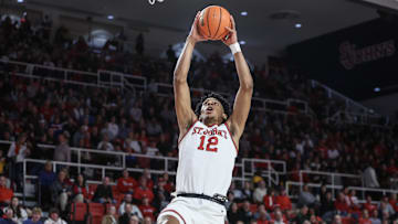 Nov 30, 2024; Queens, New York, USA;  St. John's basketball guard RJ Luis Jr. (12) goes up for a dunk in the second half against the Harvard Crimson at Carnesecca Arena. 
