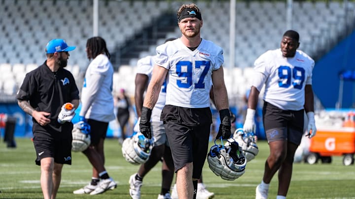Detroit Lions defensive end Aidan Hutchinson (97) walks off the field after practice during training camp at Meijer Performance Center in Allen Park on Monday, July 21, 2025.