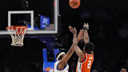 Mar 12, 2025; Charlotte, NC, USA; Syracuse Orange guard J.J. Starling (2) shoots over Southern Methodist Mustangs forward Yohan Traore (21) during the second half at Spectrum Center. Mandatory Credit: Jim Dedmon-Imagn Images