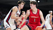 Nov 29, 2024; Paradise Island, Bahamas, BHS;  Davidson Wildcats forward Reed Bailey (1) dribbles as Gonzaga Bulldogs forward Braden Huff (34) defends during the second half at Imperial Arena at the Atlantis resort.  Mandatory Credit: Kevin Jairaj-Imagn Images