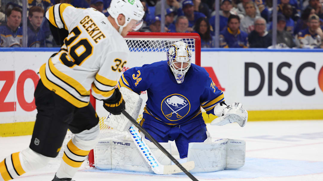 Apr 28, 2026; Buffalo, New York, USA; Boston Bruins center Morgan Geekie (39) looks to take a shot on Buffalo Sabres goaltender Alex Lyon (34) during the third period in game five of the first round of the 2026 Stanley Cup Playoffs at KeyBank Center. Mandatory Credit: Timothy T. Ludwig-Imagn Images