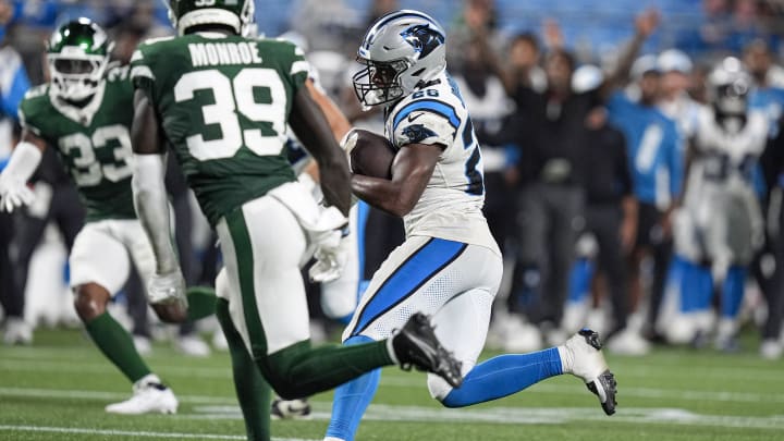 Ex-Husky Dillon Johnson (28) rushed for 83 yards for the Carolina Panthers against the New York Jets in exhibition play.  