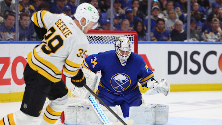 Apr 28, 2026; Buffalo, New York, USA; Boston Bruins center Morgan Geekie (39) looks to take a shot on Buffalo Sabres goaltender Alex Lyon (34) during the third period in game five of the first round of the 2026 Stanley Cup Playoffs at KeyBank Center. Mandatory Credit: Timothy T. Ludwig-Imagn Images