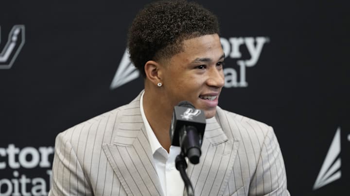 Jun 28, 2025; San Antonio, TX, USA; San Antonio Spurs first round draft pick Carter Bryant answers questions during press conference at Victory Capital Performance Center. Mandatory Credit: Scott Wachter-Imagn Images