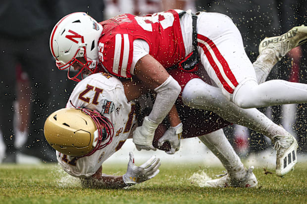 Boston College Eagles tight end Jeremiah Franklin (17) is tackled by Nebraska Cornhuskers linebacker Javin Wright (33).
