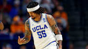 Mar 20, 2025; Lexington, KY, USA;  UCLA Bruins guard Skyy Clark (55) celebrates after a three pointer during the first half against the Utah State Aggies in the first round of the NCAA Tournament at Rupp Arena. Mandatory Credit: Aaron Doster-Imagn Images