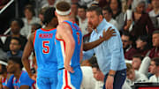 Jan 18, 2025; Starkville, Mississippi, USA; Mississippi Rebels head coach Chris Beard (right) talks with guard Jaylen Murray (5) and guard Sean Pedulla (3) during the second half against the Mississippi State Bulldogs at Humphrey Coliseum. Mandatory Credit: Petre Thomas-Imagn Images