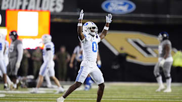 Sep 27, 2025; Boulder, Colorado, USA; Brigham Young Cougars cornerback Evan Johnson (0) celebrates a turnover in the fourth quarter against the Colorado Buffaloes at Folsom Field. Mandatory Credit: Ron Chenoy-Imagn Images