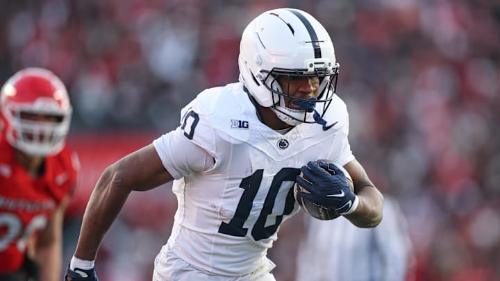 Nov 29, 2025; Piscataway, New Jersey, USA; Penn State Nittany Lions running back Nicholas Singleton (10) carries the ball against the Rutgers Scarlet Knights during the first half at SHI Stadium. Mandatory Credit: Vincent Carchietta-Imagn Images