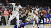 Jan 27, 2024; Coral Gables, Florida, USA; Pittsburgh Panthers forward Zack Austin (55) passes the basketball as he is defended by Miami Hurricanes guard Wooga Poplar (5) and guard Paul Djobet (10) during the first half at Watsco Center. Mandatory Credit: Sam Navarro-Imagn Images