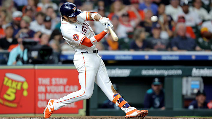 May 22, 2025; Houston, Texas, USA; Houston Astros shortstop Jeremy Pena (3) hits an RBI triple against the Seattle Mariners during the fourth inning at Daikin Park.
