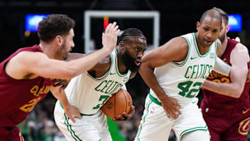 Dec 14, 2023; Boston, Massachusetts, USA; Boston Celtics guard Jaylen Brown (7) drives the ball against Cleveland Cavaliers forward Georges Niang (20) in the second half at TD Garden. Mandatory Credit: David Butler II-Imagn Images