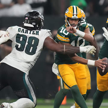 Green Bay Packers quarterback Jordan Love (10) is pressured by Philadelphia Eagles defensive tackle Jalen Carter (98) on Friday.