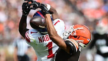 Sep 22, 2024; Cleveland, Ohio, USA; Cleveland Browns cornerback Greg Newsome II (0) breaks up a pass intended for New York Giants wide receiver Malik Nabers (1) during the second half at Huntington Bank Field. Mandatory Credit: Ken Blaze-Imagn Images