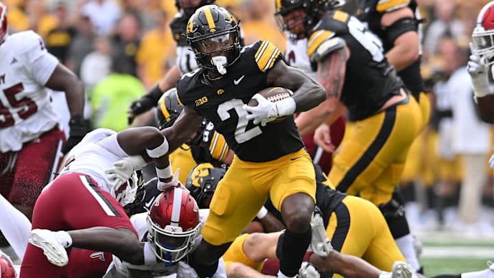 Sep 14, 2024; Iowa City, Iowa, USA; Iowa Hawkeyes running back Kaleb Johnson (2) runs the ball against the Troy Trojans during the first quarter at Kinnick Stadium. Mandatory Credit: Jeffrey Becker-Imagn Images