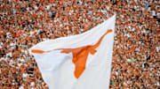 Sep 4, 2016; Austin, TX, USA; The Texas Longhorns logo flag flies during the game between the Texas Longhorns and the Notre Dame Fighting Irish at Darrell K. Royal-Texas Memorial Stadium. Texas won 50-47 in double overtime.