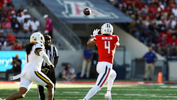 Oct 26, 2024; Tucson, Arizona, USA; Arizona Wildcats wide receiver Tetairoa McMillan (4) catches the ball during the first quarter against the West Virginia Mountaineers at Arizona Stadium. Mandatory Credit: Aryanna Frank-Imagn Images