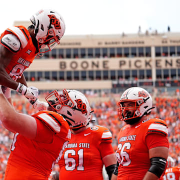 Oklahoma State's Brennan Presley (80) celebrates his touchdown with Cole Birmingham (67) first half of the college football game between the Oklahoma State Cowboys and South Dakota State Jackrabbits at Boone Pickens Stadium in Stillwater, Okla., Saturday, Aug., 31, 2024.