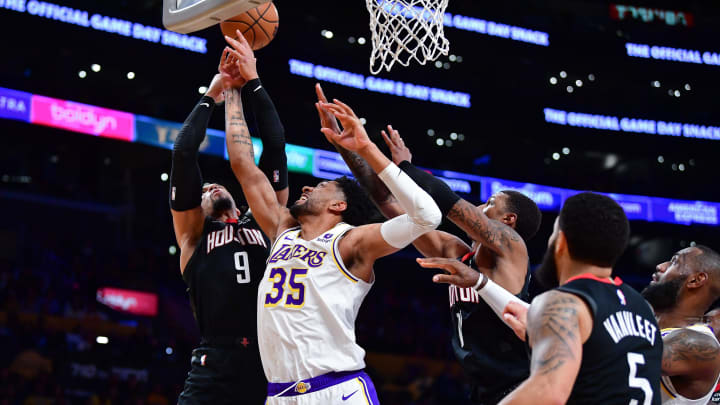 Dec 2, 2023; Los Angeles, California, USA; Los Angeles Lakers forward Christian Wood (35) plays for the rebound against Houston Rockets forward Dillon Brooks (9) during the first half at Crypto.com Arena. Mandatory Credit: Gary A. Vasquez-USA TODAY Sports