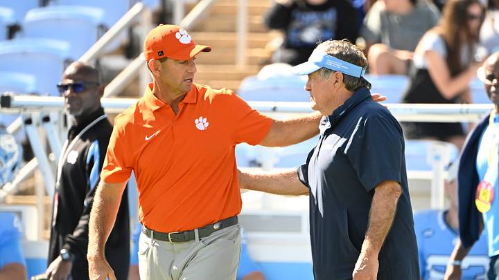 Oct 4, 2025; Chapel Hill, North Carolina, USA; Clemson Tigers head coach Dabo Swinney with North Carolina Tar Heels head coach Bill Belichick before the game at Kenan Stadium. Mandatory Credit: Bob Donnan-Imagn Images