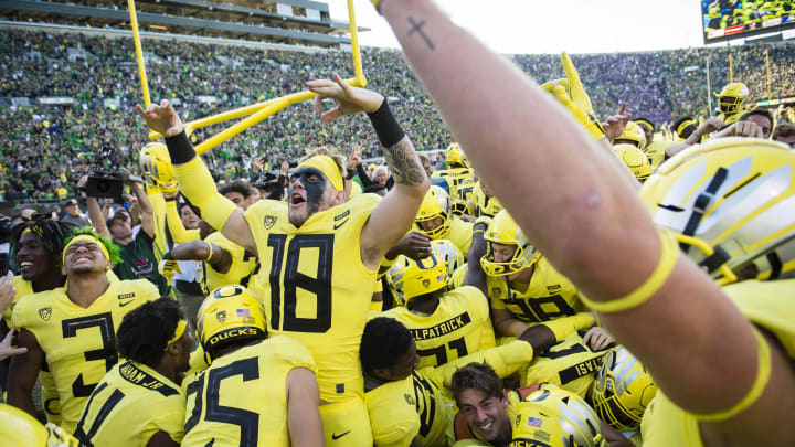 Oct 13, 2018; Eugene, OR, USA; The Oregon Ducks celebrate in the end zone after a game against Washington Huskies at Autzen Stadium. The Ducks won in overtime 30-27.