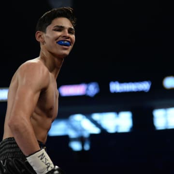 May 6, 2017; Las Vegas, NV, USA; Ryan Garcia (black/gold trunks) reacts after defeating Tyrone Luckey (not pictured) in their lightweight bout at T-Mobile Arena. Garcia won via second round TKO.